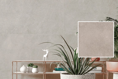 porcelanato_tipo_cemento-LIMESTONE-GREY Porcelanato gris en pared decorativo antideslizante con plantas verdes y pieza de ceramica 60x60cm gris